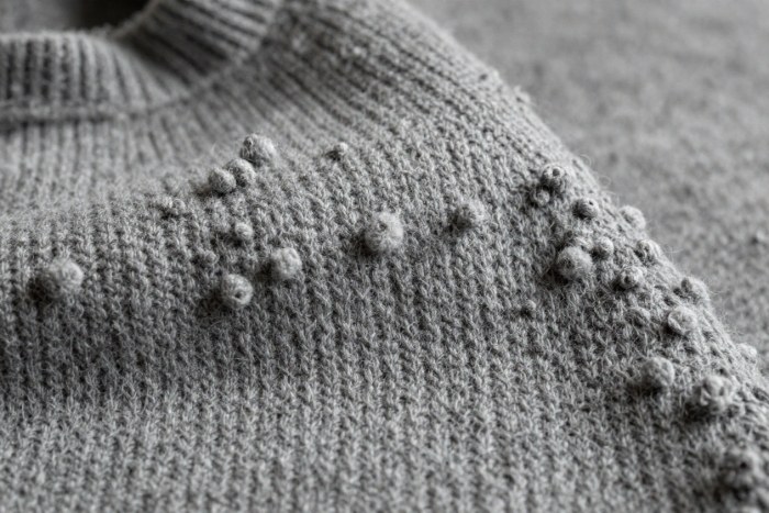 Worn gray sweater with heavy pilling,without finishes treatment
