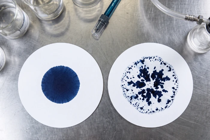 Filter paper test comparing even disperse dye dispersion and uneven aggregation